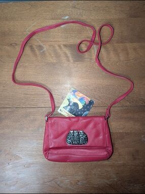 Red Leather Crossbody Bag with Decorative Cat Accent